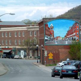 Living History Historical Mural painted on the side of a building in Bellows Falls, Vermont by Charles C. Clear III and Bonnie Lee Turner